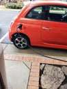 Red Electric Car in the parking lot of Charging Station. The process of connecting a car to a charging station Royalty Free Stock Photo