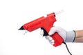 Red electric glue gun. On a white isolated background.