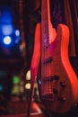 Red electric guitar and classic amplifier on a dark background. Royalty Free Stock Photo