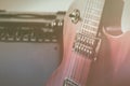 Red electric guitar and classic amplifier on a grey background Royalty Free Stock Photo