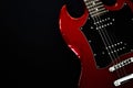 Red electric guitar closeup  on black background Royalty Free Stock Photo