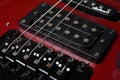 Red electric guitar. Electric guitar pickups close-up. Royalty Free Stock Photo