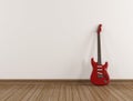 Red electric guitar in a empty room Royalty Free Stock Photo