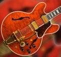 Red Electric Guitar with God Hardware and Figured Maple Top