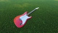 A red guitar in the grass field