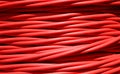 red electrical cable for transporting high-voltage electricity from power plant to substations