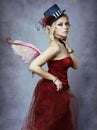 Red elf fairy in fancy hat Royalty Free Stock Photo