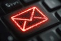 Red Email Symbol on Keyboard Key Illuminated in Digital Environment Royalty Free Stock Photo