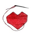 Red embroidered heart with needle and thread.
