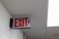 red emergency exit sign in the dark room. illuminated office exit sign Royalty Free Stock Photo