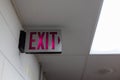 red emergency exit sign in the dark room. illuminated office exit sign Royalty Free Stock Photo