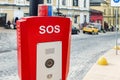 Red emergency police SOS call button alarm box with light bar, cctv camera and speaker device for urgent comunication on Royalty Free Stock Photo