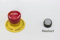 Red emergency stop and black reset button