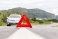 Red emergency stop sign and broken silver car Royalty Free Stock Photo