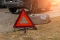 Red emergency stop sign warning sign of a red triangle and a broken car on the road. close-up of the red emergency Royalty Free Stock Photo