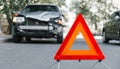 Red emergency stop triangle sign on road in car accident scene. Broken SUV car on road at traffic accident. Car crash traffic Royalty Free Stock Photo