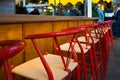 Red empty bar stools before opening Royalty Free Stock Photo