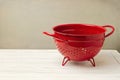 Red empty colander Royalty Free Stock Photo