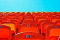 Red bright empty plastic seats on the sports platform of the stadium Royalty Free Stock Photo