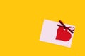 Red empty tag in a heart shape with tied ribbon bow and envelope. Royalty Free Stock Photo
