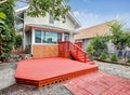 Red empty walkout deck at the back yard