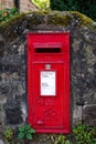 Red English Postbox in Mossy Wall