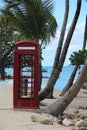 Red English Telephone Booth on Beach Royalty Free Stock Photo