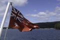 Red Ensign flag of Tasmania with flies on the aft deck of a boat Royalty Free Stock Photo