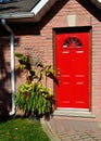 Red entrance door of a house. Royalty Free Stock Photo
