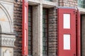 Red entrance door to the brick building Royalty Free Stock Photo