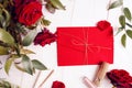 Red envelope with golden strings and red roses