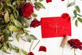 Red envelope with golden strings and red roses