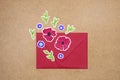 Red envelope with hand drawn flowers deco arrangement on neutral background. Greetings concept, invitation, wedding birthday card Royalty Free Stock Photo