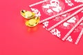 Red envelopes and gold ingot ornaments.The Chinese characters in the picture mean `make more money` and `happiness` Royalty Free Stock Photo