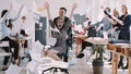 RED EPIC-W Happy smiling blonde business woman having fun with office colleagues throwing paper on chair slow motion.