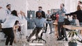 RED EPIC-W Happy young black businessman celebrating birthday at office workplace party with confetti slow motion. Royalty Free Stock Photo