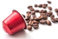 red espresso coffee capsule with coffee beans on whit