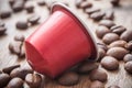 red espresso coffee dose with coffee beans on wooden