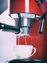 Red espresso coffee machine is making a coffee Royalty Free Stock Photo