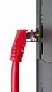 Red Ethernet Cable Plugged into Computer Port Royalty Free Stock Photo