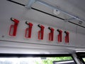 Red evacuation hammers on German public transport, translation on the windows is emergency exit Royalty Free Stock Photo