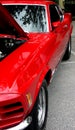 Red exotic sports car with view in side mirror