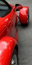 Red exotic sports car with view in side mirror