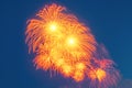 Red explosions of salutes in the sky, with falling sparks Royalty Free Stock Photo