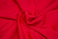 Red fabric background. Red cloth waves background texture. Royalty Free Stock Photo