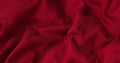 Red fabric background. Red cloth waves background texture.