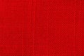 Red fabric background texture. Detail of textile material close-up Royalty Free Stock Photo