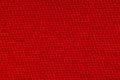 Red fabric background texture. Detail of textile material close-up Royalty Free Stock Photo