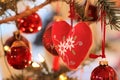 Red fabric heart at Christmas tree Royalty Free Stock Photo