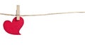 Red fabric heart hanging on the clothesline